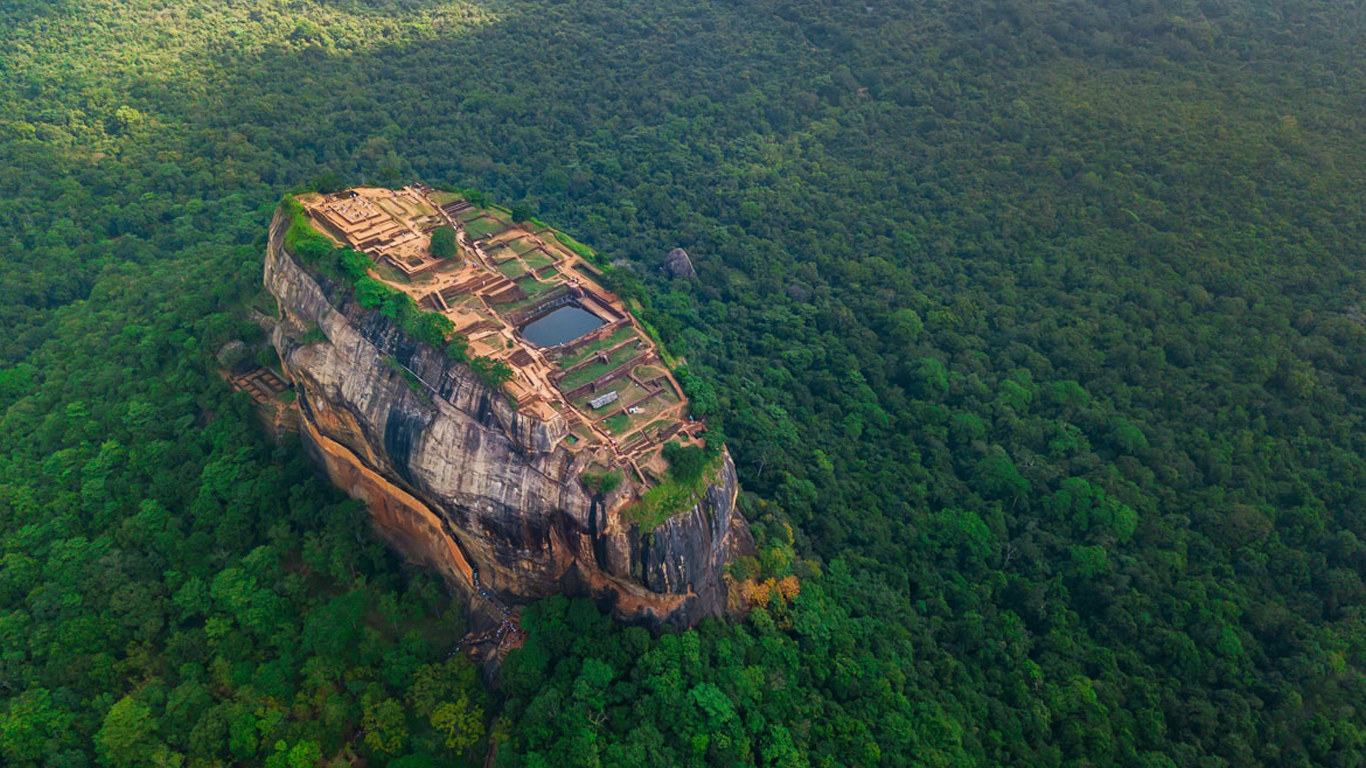 Aerial view of Sigiriya rock at misty morning, Sri Lanka. Drone